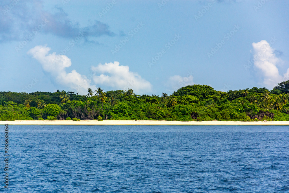 Stunning tropical beach with white sand in the Maldives. a great place to dive into meditation and Nirvana Stunning tropical beach with white sand in the Maldives. a great place to dive into meditation and Nirvana