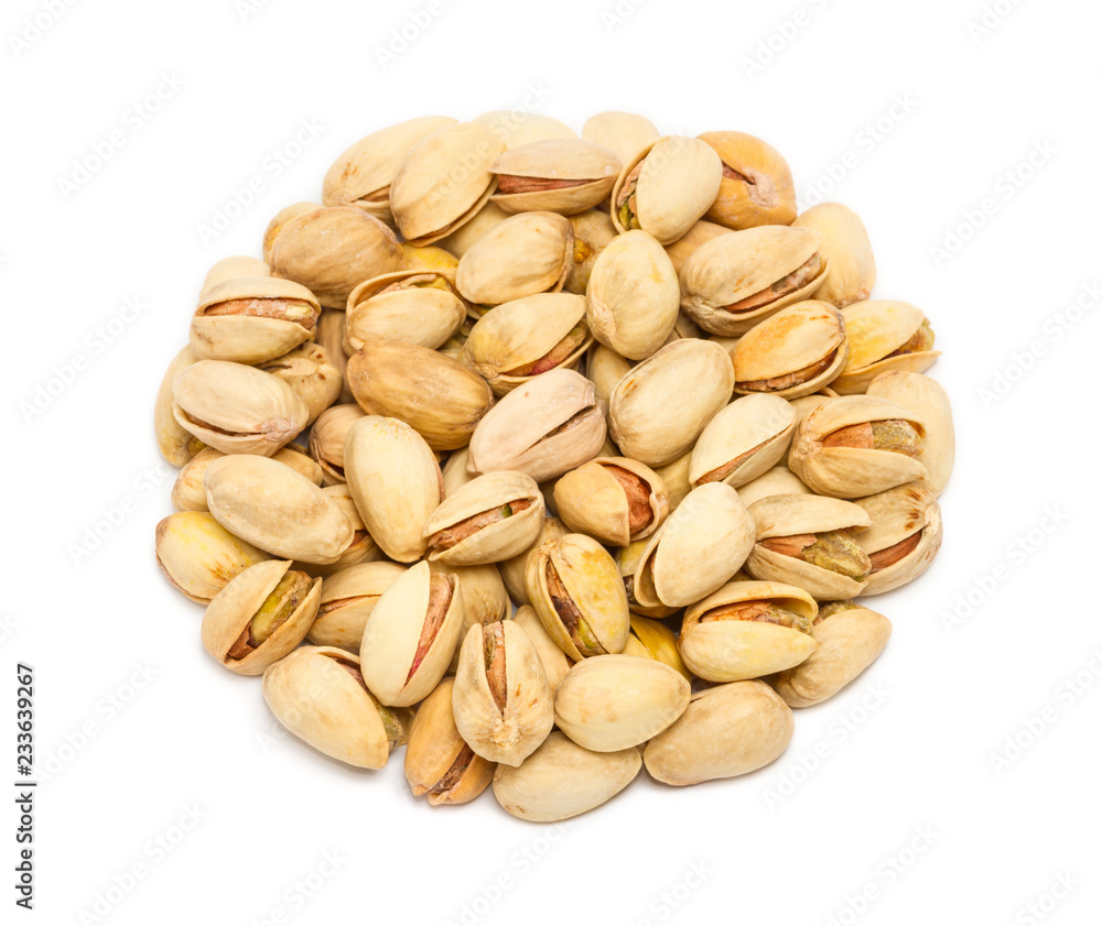 Handful of pistachio nuts (Pistacia vera) in the shell, close up, isolated on white background Handful of pistachio nuts (Pistacia vera) in the shell, close up, isolated on white background