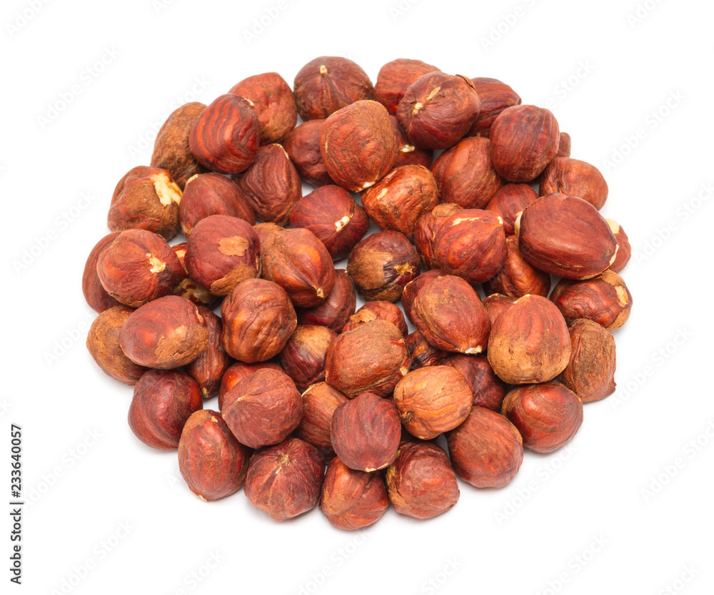 Handful of peeled ripe hazelnuts closeup, isolated on white background Handful of peeled ripe hazelnuts closeup, isolated on white background