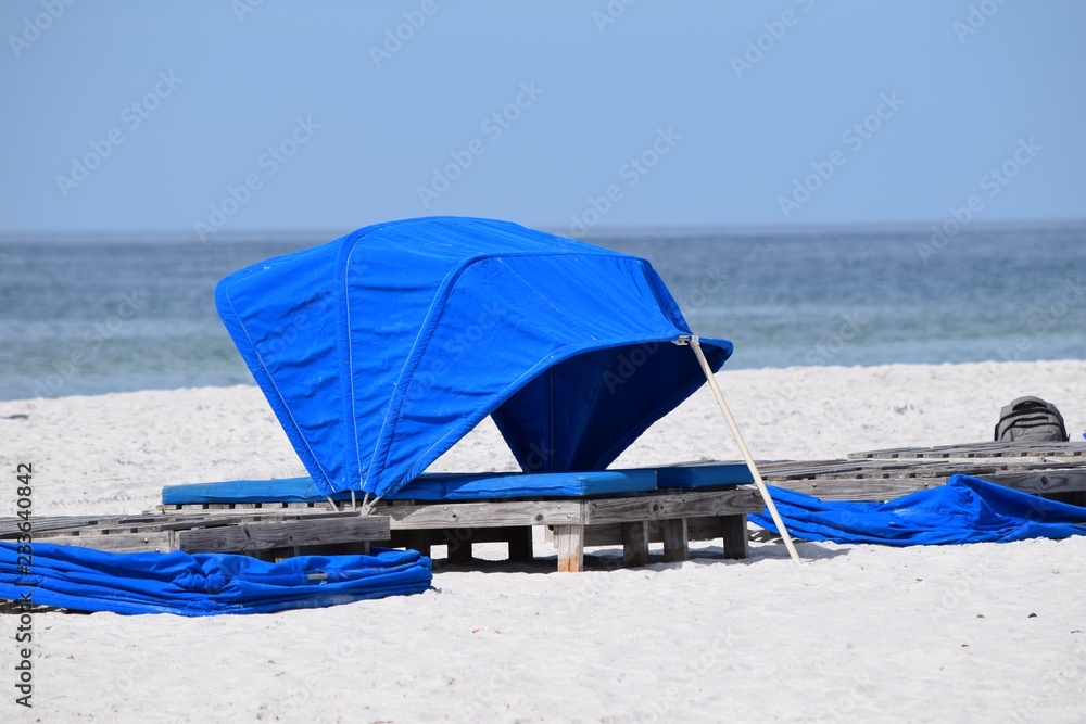 Landscape blue relaxing cabana set up on white sand beach resort reserved