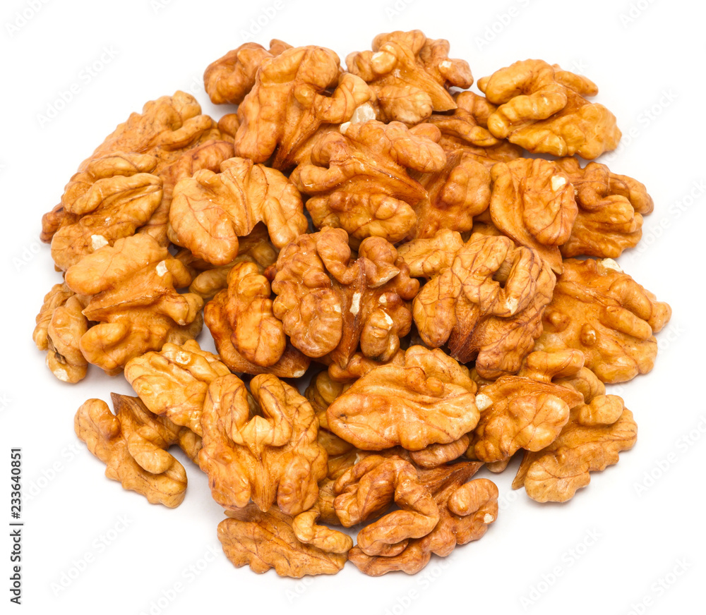 Handful of peeled walnut (Juglans regia) without shell, close up, isolated on white background Handful of peeled walnut (Juglans regia) without shell, close up, isolated on white background