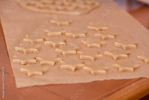 cutouts of cookie dough on the wooden board