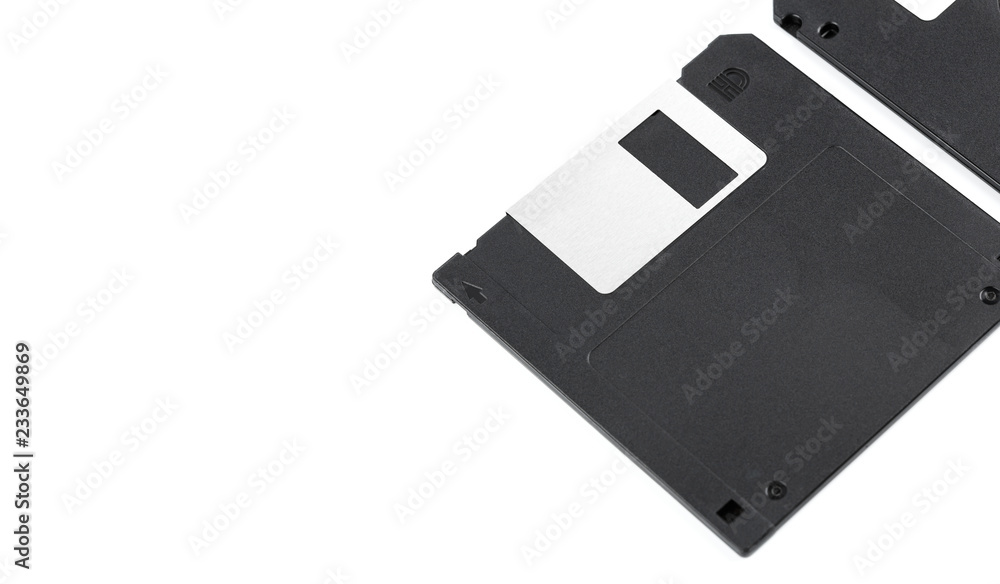 Old computer diskette over white background. Black Diskette. Old computer diskette over white background. Black Diskette.