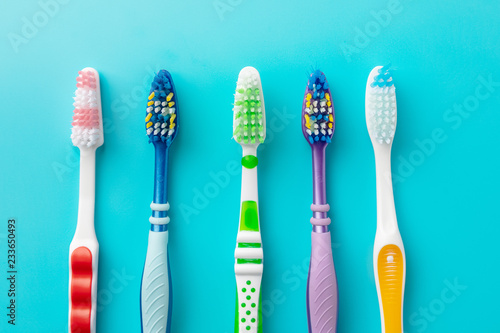 toothbrushes in the form on a blue background © alas_spb