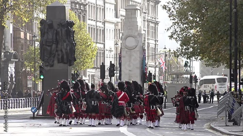 UK November 2018 - The Scottish Highlanders Pipes and Drums march away, past war memorials on Whitehall during Armistice remembrance events on the centenary of the end of World War One.