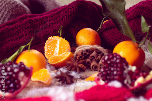 warm winter with tangerines  pomegranate and sweater