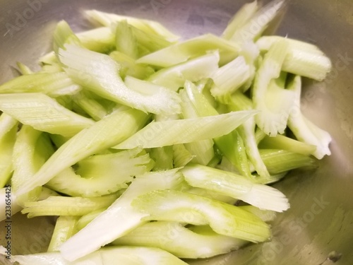 Cut celery in a metal bowl