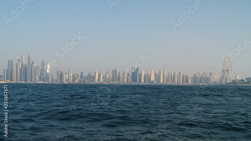 View of Dubai skyline in a foggy day from the sea