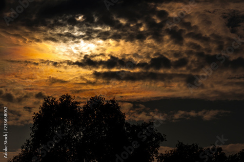 Cloudy black and orange sky during sunset - Photography © Carlo Toffolo