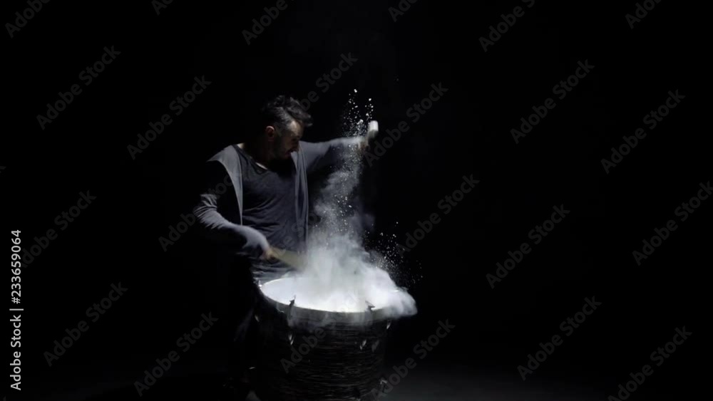 portrait of a drummer in profile on a black background portrait of a drummer in profile on a black background