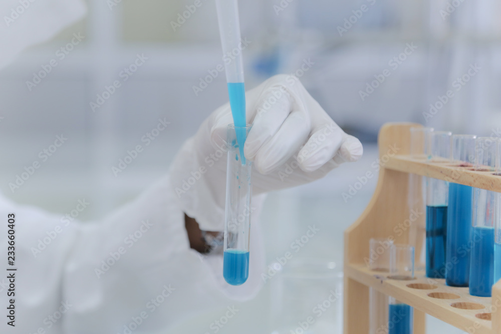 Fototapeta premium Young African Female Laboratory scientist working at lab with test tubes, test or research in clinical laboratory.Science, chemistry, biology, medicine and people concept.