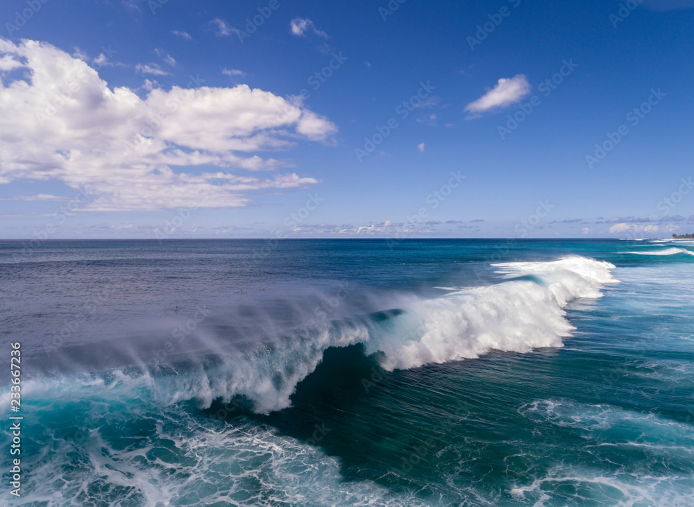 Aerial view of a big breaking wave