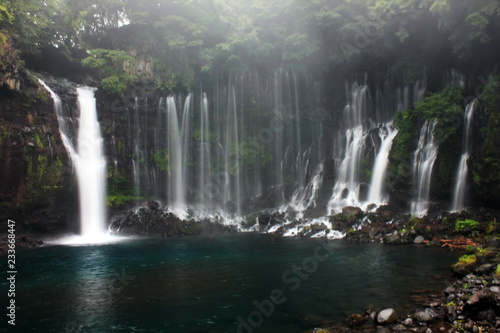 Shiraito Waterfall is a beautiful waterfall in Japan, it is very clear water to see the fish. good scene of waterfall. © popdraft