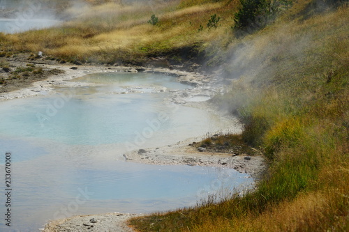 View of turquoise water pools in the West Thumb Geyser Basin in Yellowstone National Park, United States