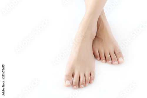 Beautiful female legs and feet on a white background.Concept beauty and hydration of the skin.