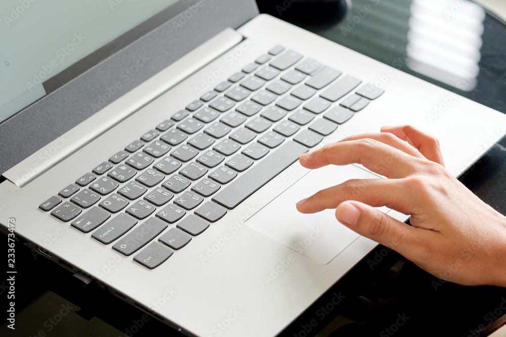 Hand of the worker He is using a computer Hands on the keyboard. Find the information on the internet at the corporate office.Technology concept Hand of the worker He is using a computer Hands on the keyboard. Find the information on the internet at the corporate office.Technology concept