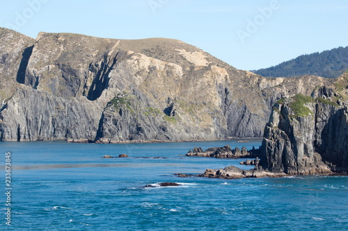 Landscape image of the rugged coastline and sea of the scenic Marlborough Sounds of New Zealand.