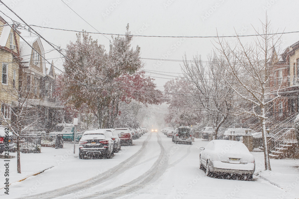 Residential neighborhood during snow thunder, snow fall, car covered snow Residential neighborhood during snow thunder, snow fall, car covered snow