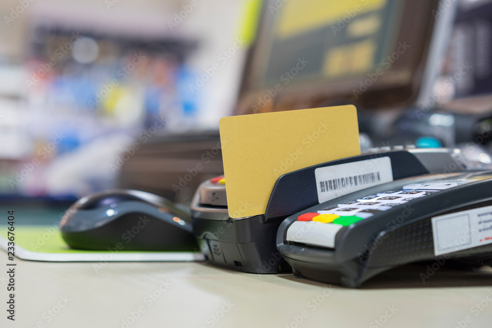 Credit Card reader on cashier table Credit Card reader on cashier table