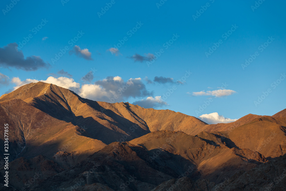 Early morning sunlight on the peaks  with blue sky at Leh, Ladakh, Jammu and Kashmir, India