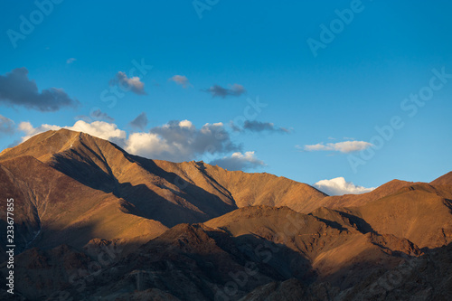 Early morning sunlight on the peaks with blue sky at Leh, Ladakh, Jammu and Kashmir, India