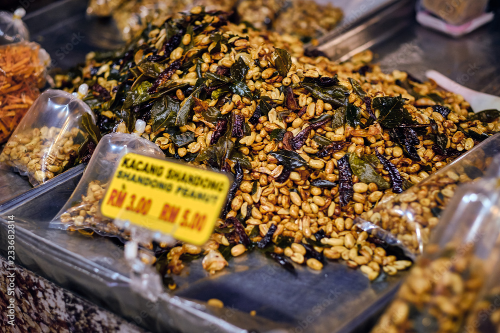 Fried peanut with chilly pepper - traditional asian street food. Asian, Indian and Chinese street food. Food court on local market of Langkawi island, Malaysia.