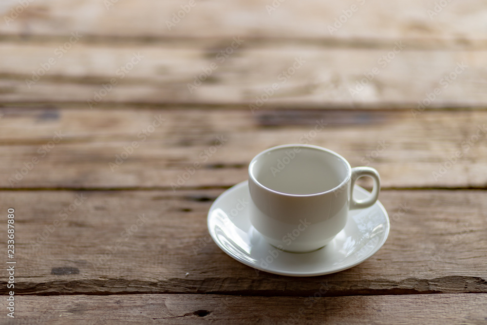 cup of coffee on a wooden table in the morning cup of coffee on a wooden table in the morning