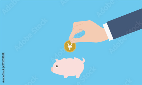 貯金箱とコインを持つ手