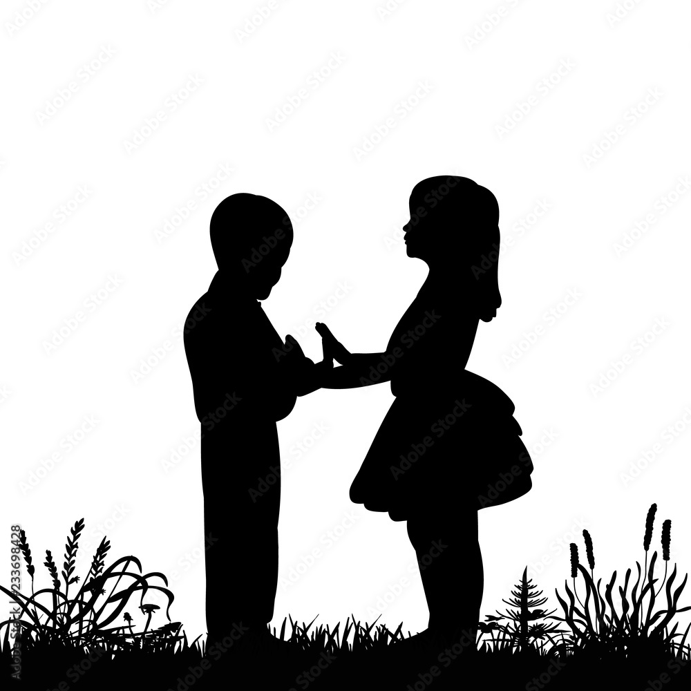 silhouette of children standing on the grass silhouette of children standing on the grass