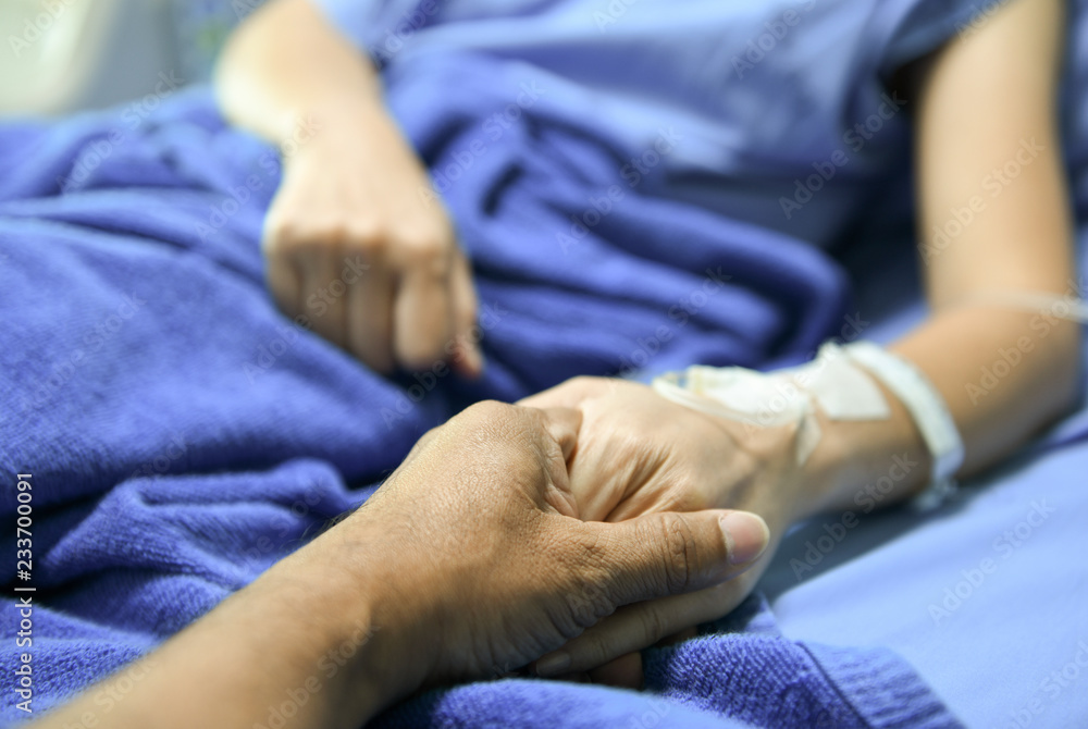 Shake hands to encourage the patient.