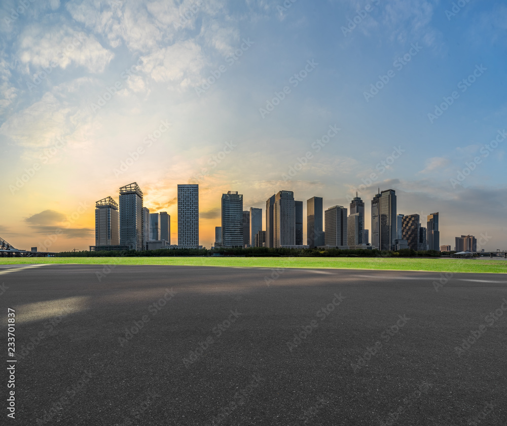 empty asphalt road with city skyline background in china. empty asphalt road with city skyline background in china.