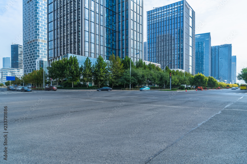 city empty traffic road with cityscape in background. city empty traffic road with cityscape in background.