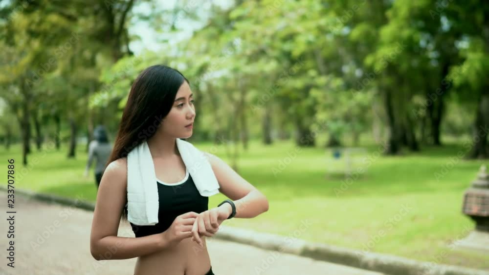 young sporty woman with smart watch in the park young sporty woman with smart watch in the park