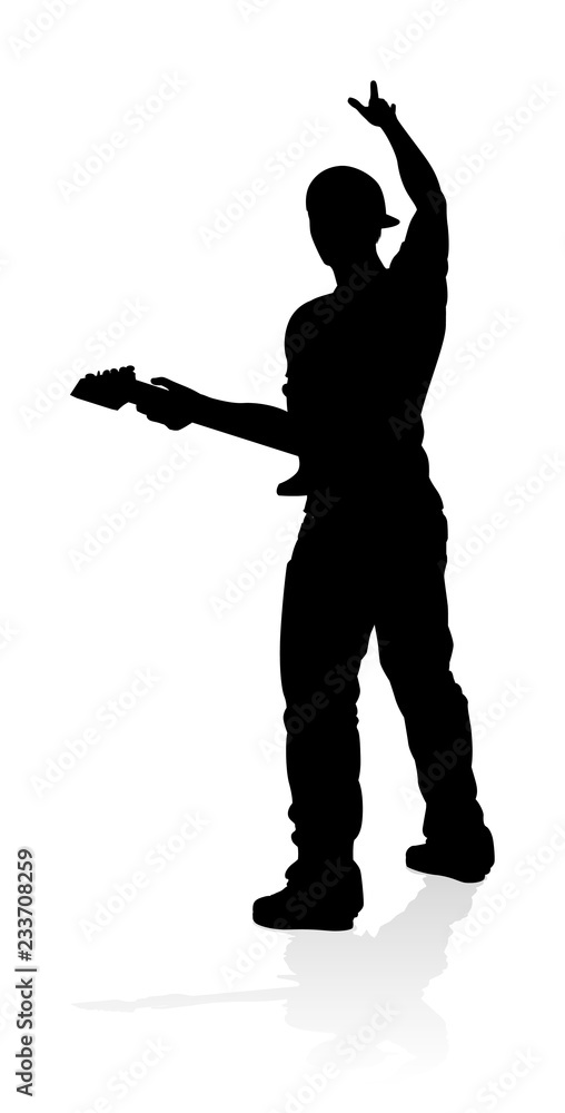 A guitarist musician in detailed silhouette playing his guitar musical instrument.