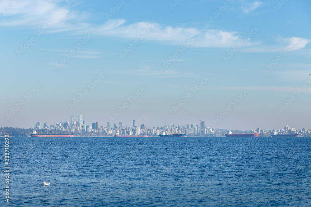 Downtown Vancouver with tanker ships in the foreground.