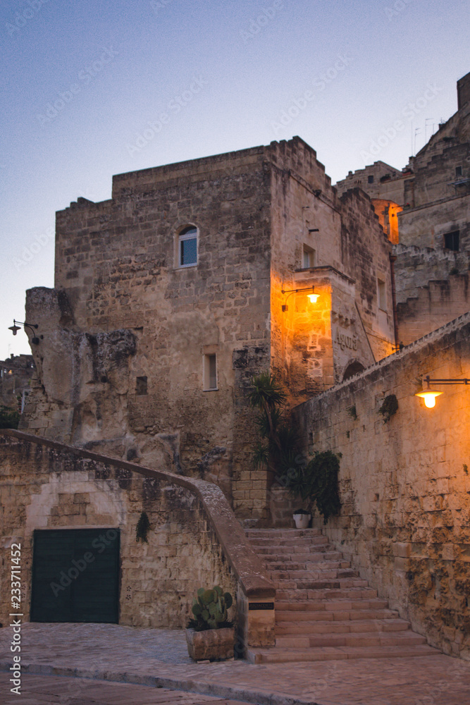 Evening view of ald stone house in ancient town of Matera (Sassi di Matera), Basilicata, Italy