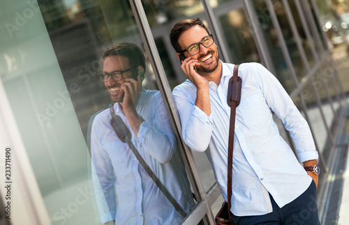 Businessman having tablet and phone at hand
