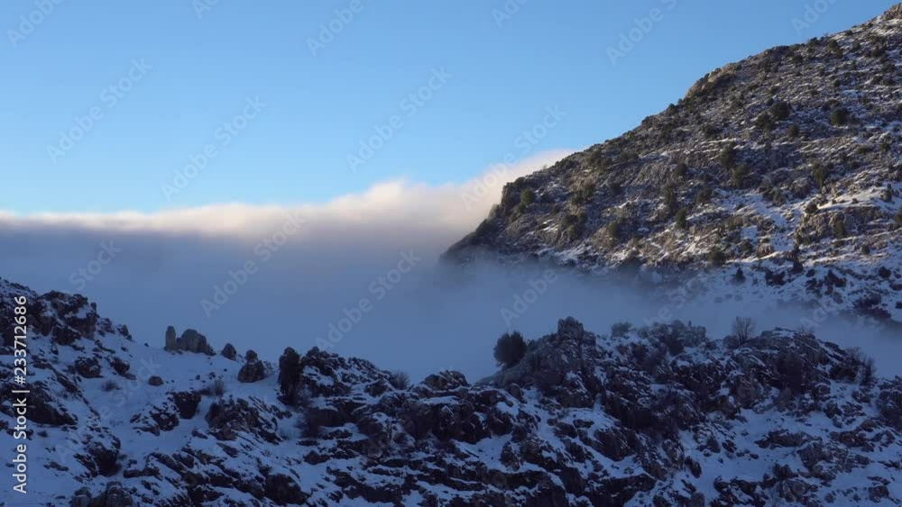 Bed of clouds under us, mountains and snow Bed of clouds under us, mountains and snow