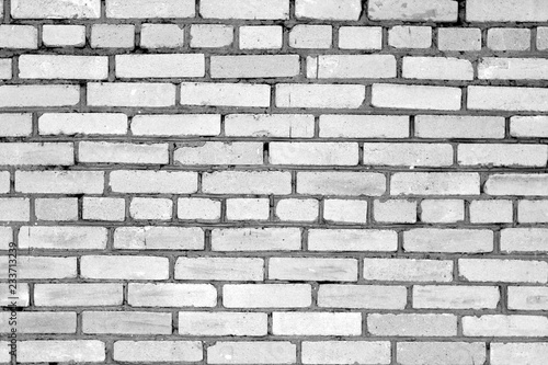 Old grungy brick wall surface in black and white.