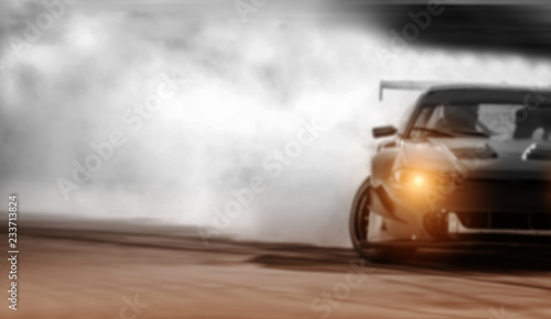 Car drifting  Sport car wheel drifting and smoking on blurred background.