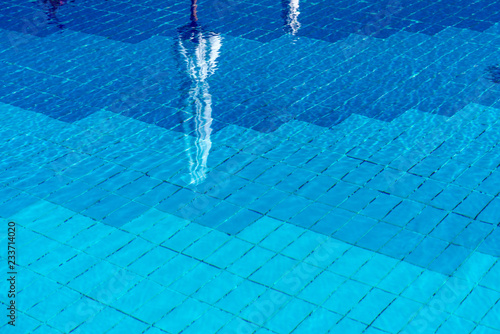 Background with a Blue Water in a Swimming Pool © Alberto Masnovo