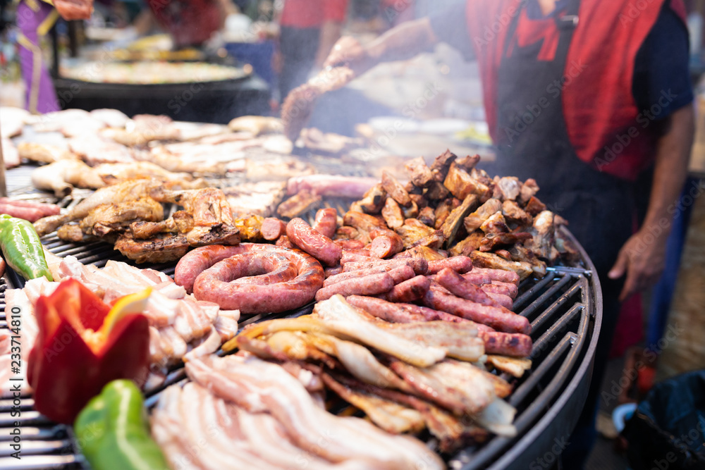 Delicious grilled meat with vegetables over the coals on a barbecue