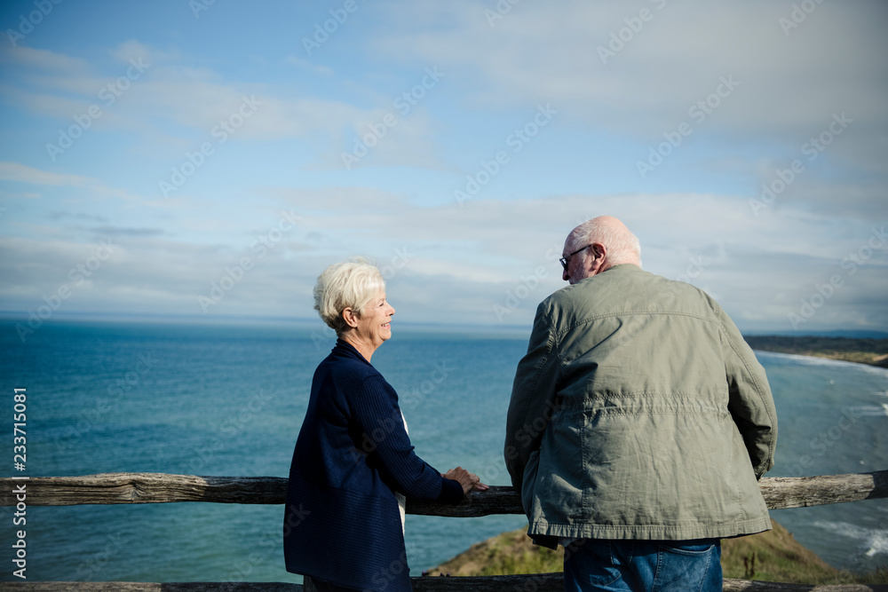 Fototapeta premium Happy senior couple enjoying the view of the ocean