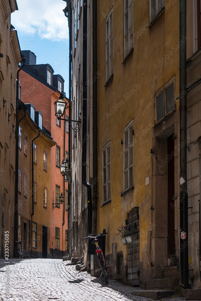 Narrow street with colorful buildings of Old Town in Stockholm, Sweden Narrow street with colorful buildings of Old Town in Stockholm, Sweden