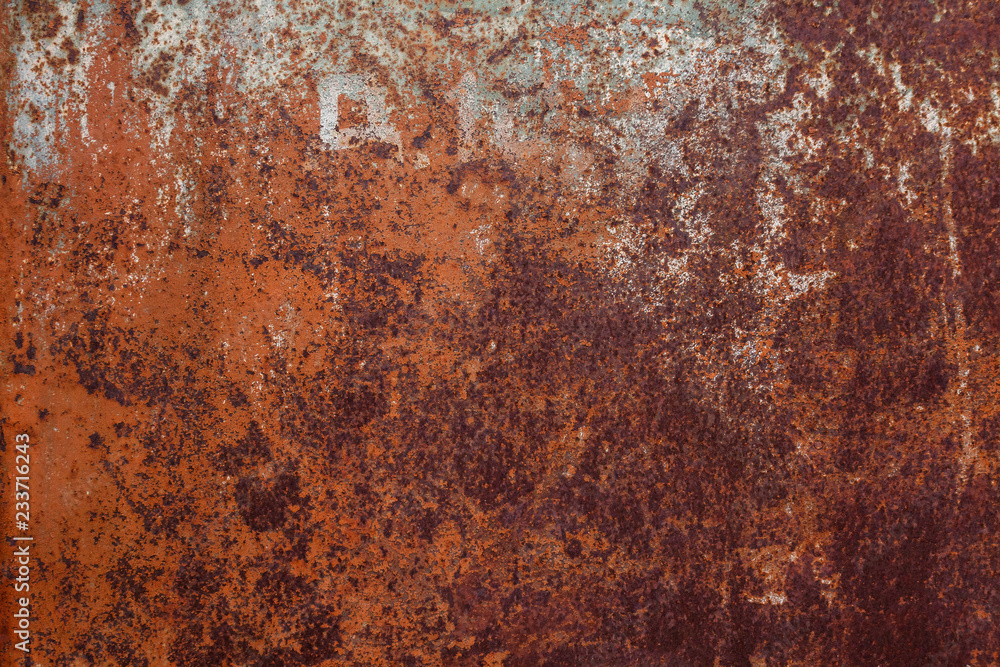 Rusty yellow-red textured metal surface. The texture of the metal sheet is prone to oxidation and corrosion. Textured background in grunge Style