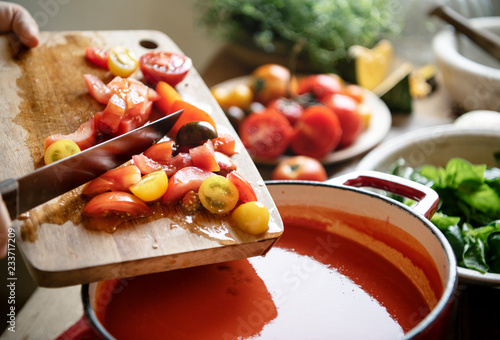 Canvas Print Homemade tomato soup cooking in the kitchen
