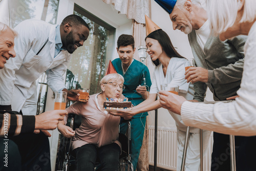 Guests Hold Glasses of Drinks. Nurse Hold Cake.