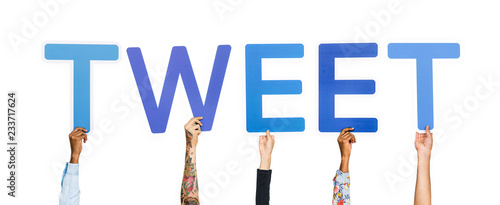Diverse hands holding the word tweet