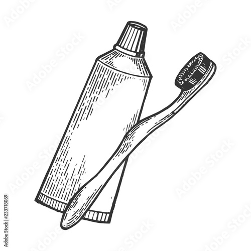 Toothbrush and toothpaste engraving vector illustration. Scratch board style imitation. Hand drawn image.