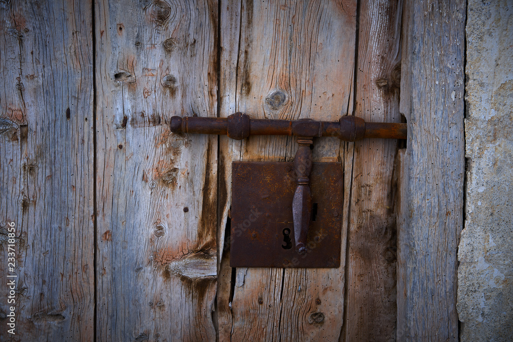 Ancient door lock in rusted iron Ancient door lock in rusted iron